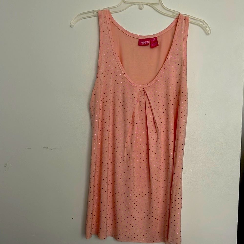 Medium light pink with Polk dots.  Never worn.  Good with a pair of jeans.